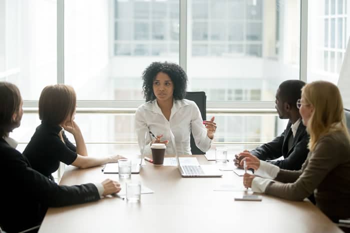 In-House Counsel Job Placement image of a woman attorney leading a group
